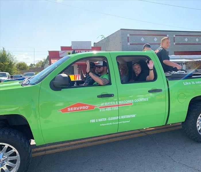Our production manager Kyle and Franchise owner Jarod driving the SERVPRO truck through the Chouteau Days Parade. 